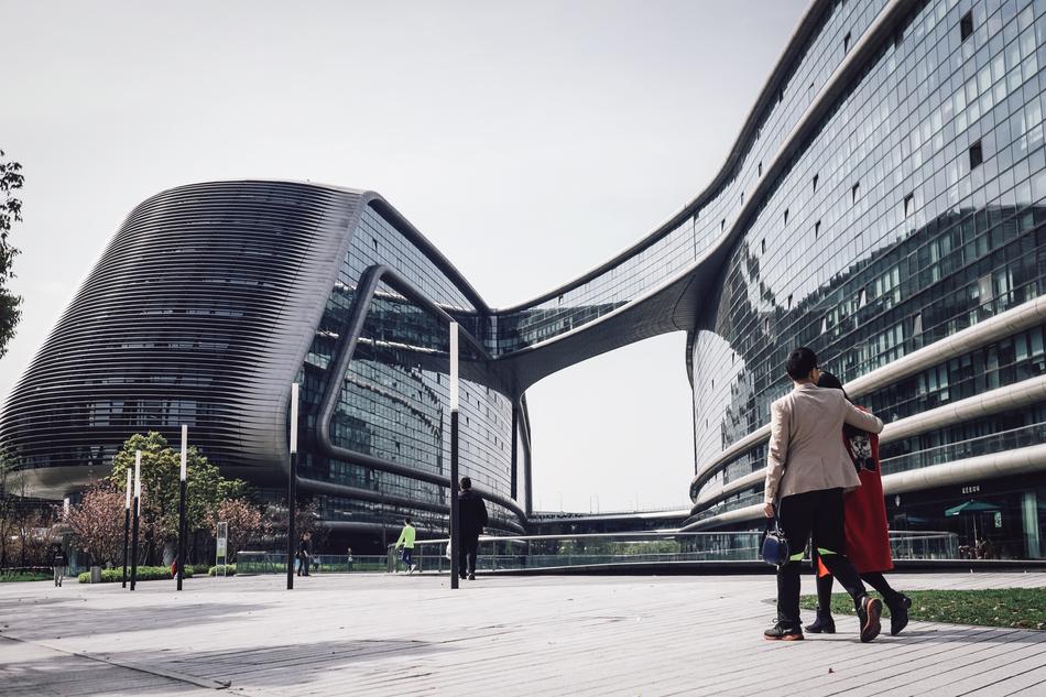 people in city at futuristic Building