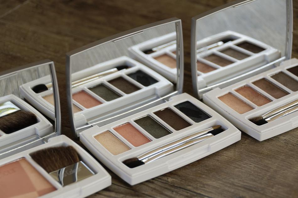 Close-up of the colorful and beautiful cosmetics with the mirrors and brushes