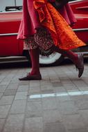 orange dressed woman Walking on street