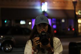 girl photographer at night city