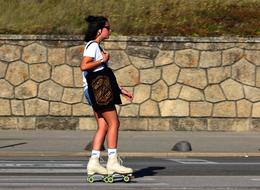 Woman Rollerblades Ride