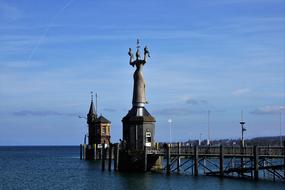 statue at the entrance to the harbor in konstanz