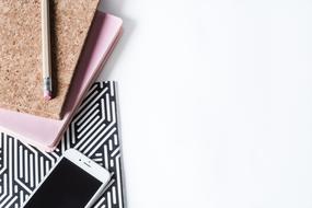 Flatlay, female Desktop with pencil and telephone