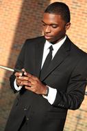 Young african Businessman with phone