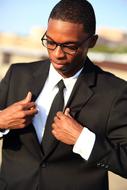 photo of a black young man in a business suit
