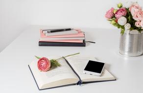 still life with flower, book and smartphone