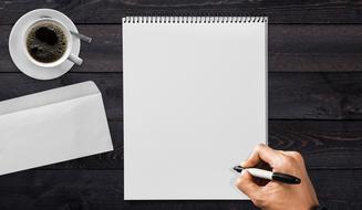Writing Pad and Hand and coffee