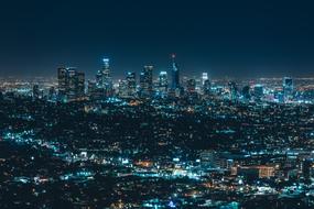 cityscape with glowing skyscrapers at night