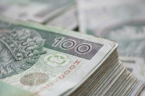 Close-up of the stack of the colorful money banknotes, with the numbers