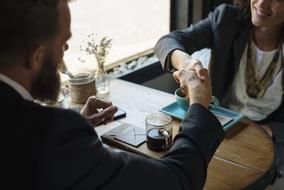 man and woman at a table in a cafe