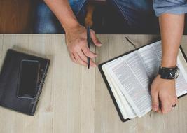 Man in office with book