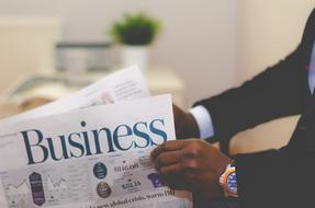 Business Man read Newspaper