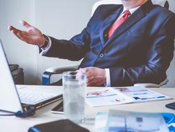 businessman at desk with Laptop Computer