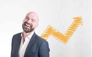 Startup Entrepreneur, happy caucasian man at orange arrow