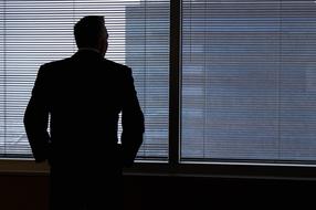 Business Man thinking window