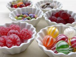 colorful Candies in white Bowls