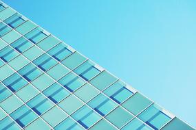 Modern glass stracture of the building on blue sky background