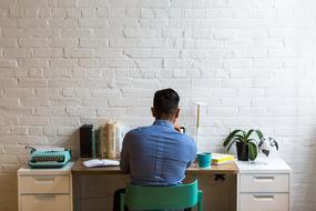 Man in blue Work at home
