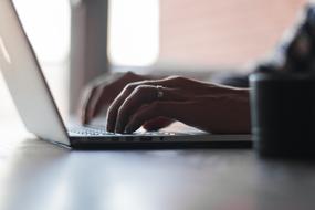 Typing On The Beautiful Apple Laptop