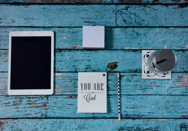 tablet and notebook on the desk