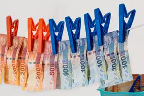 bills are dried on clothespins