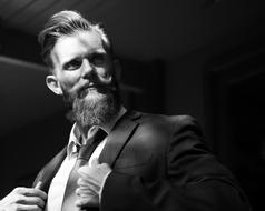 black and white photo of a stylish businessman with a beard