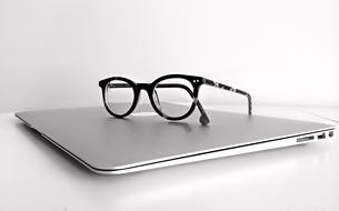 Macbook Laptop and glasses