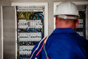 worker at the electrical panel