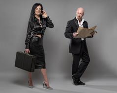 surprised senior man looks at sexy adult woman in black leather clothe
