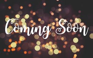 White "Coming Soon" sing at background with colorful bokeh lights