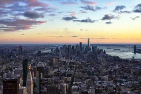 photo of multi-storey office buildings in New York against the evening sky