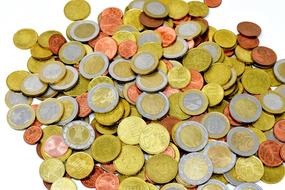 Big pile of metal coins on white background