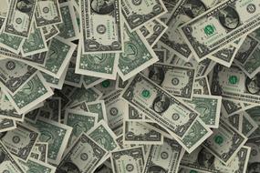 pile of one dollar banknotes
