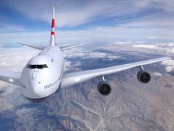 airliner flies over the mountains