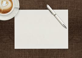 pen and paper and coffe