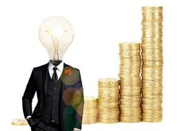 silhouette of a man with a lamp instead of a head on the background of a stack of coins