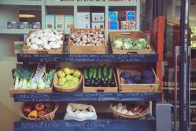 fresh vegetables in wooden crates at the supermarket