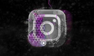 instagram icon behind transparent electronic plate at darkness