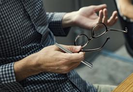 man hand glasses