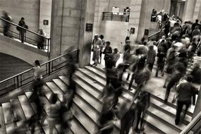 crowd of people on the stairs in a blur