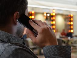 back view of Man Talking On The Phone