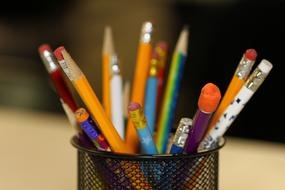 multicolored simple pencils in a glass