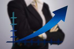 Businesswoman behind diagram of growth