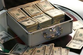 Dollars in the case and on the table