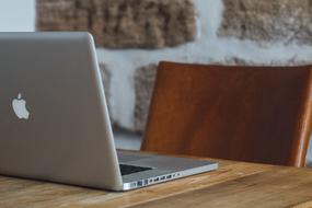 open laptop on a wooden table