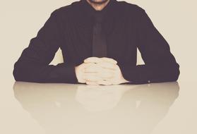 Businessman with the black shirt and tie