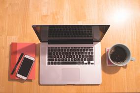 Tools for the work and coffee on the table