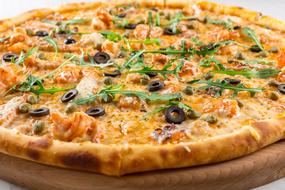 hot pizza with arugula and olives