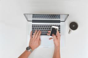 desk with computer and phone