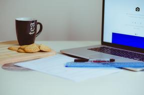 workplace with tea and cookies